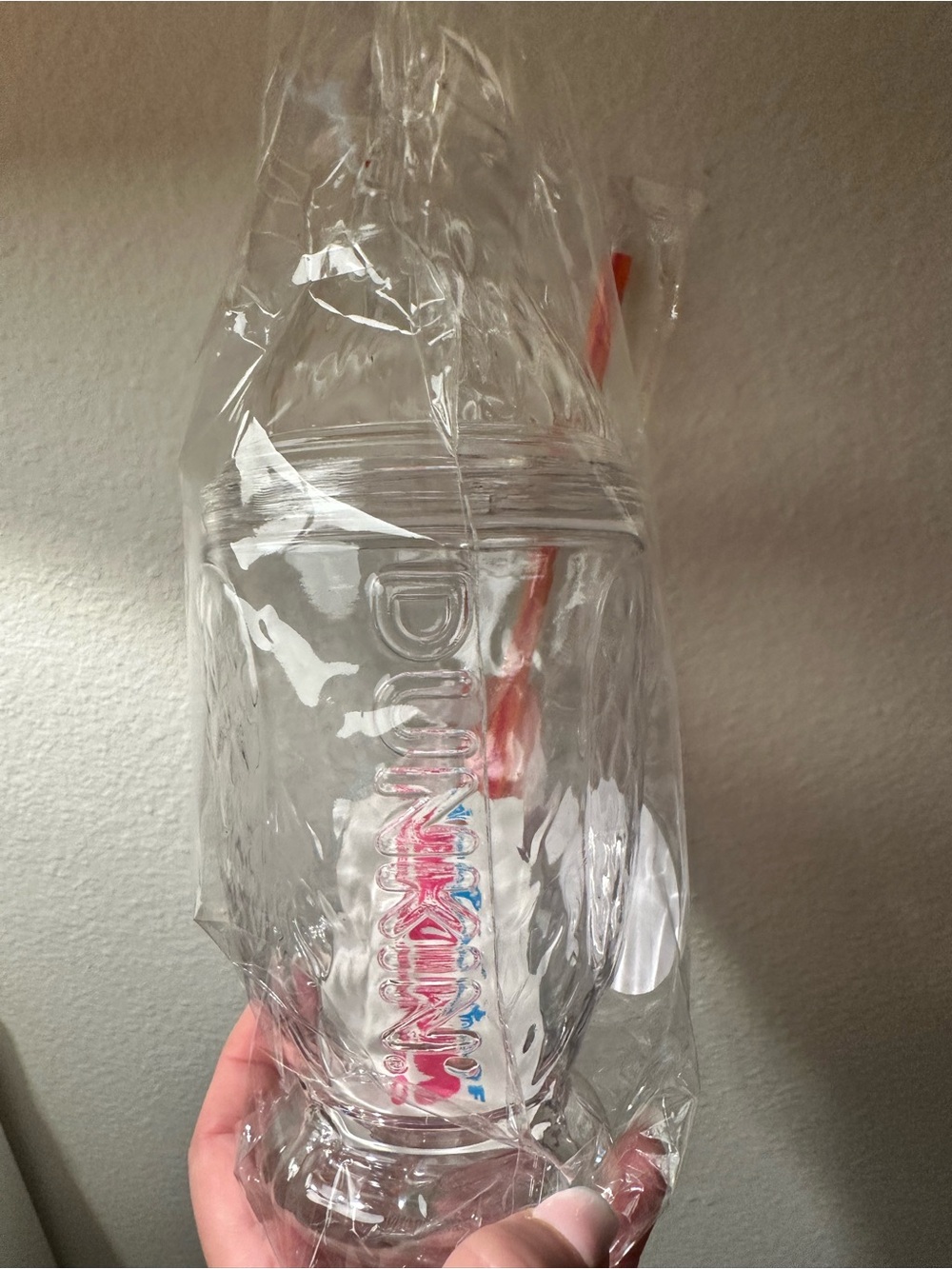 Clear Plastic Tumbler with Red-Orange Straw